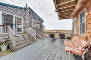 Image of Charming, waterfront cottage with a full kitchen & furnished deck