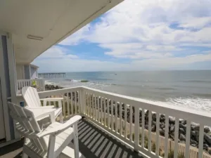 Image of Beach Sunrise - Relaxing and Romantic! Enjoy ocean views from the bedroom with balcony access. 1 Condo by RedAwning