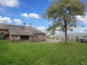 Image of Farmhouse situated at the edge of the woods