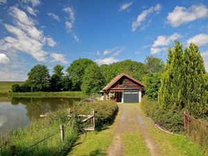 Image of Waterfront Cottage With Pond
