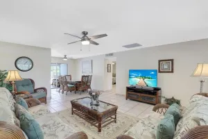 Image of Cozy home with sunroom, pool and steps to beach
