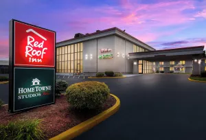 Image of HomeTowne Studios by Red Roof Painted Post
