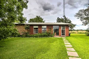 Image of On Scenic 60-Acre Farm Carmine Cottage with Porch