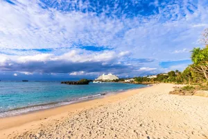 Image of Mr.KINJO in front of Manza Beach