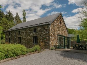 Image of Rustic Holiday Home with Sauna & Hot Tub in Wooded Area