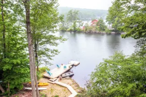 Image of Waterfront Highland Lake Home with Deck and Dock
