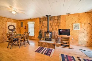 Image of The Burgundy Cabin Iowa Retreat Pond and Fire Pit