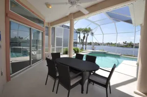 Image of Sunset Bay Beautiful Pool Home - Bring Your Boat or Jet Ski - Canal with Dock- Sleeps 10 - 4 BD