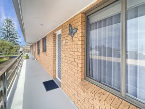 Image of Serene Coastal Retreat With Carport