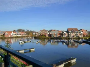Image of Waterside Townhouse With Balcony And Marina View