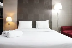 Image of Prime and Comfy Studio at Tamansari La Grande Apartment By Travelio