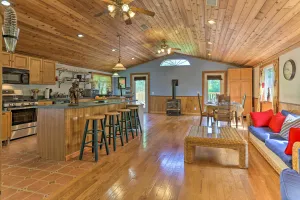 Image of Bright Tucked-Away Cabin with Furnished Deck and Grill