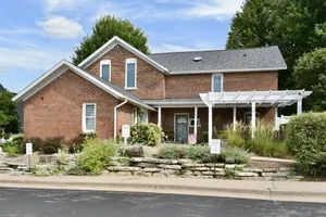 Image of Charming Brick Farmhouse with a Touch of Elegance.  -Winona