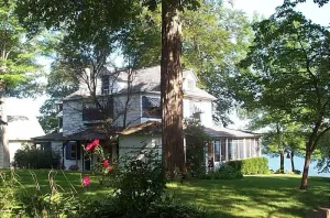 Image of Gorgeous Sandy Beachfront Paw Paw lake home with 155 ft. of frontage and dock