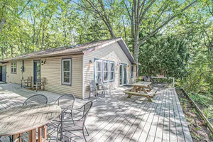 Image of Cozy, lakefront cabin with gas grill and wrap-around deck.