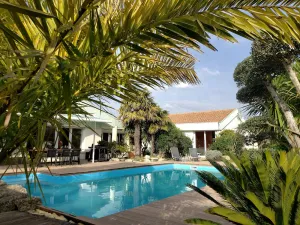 Image of Villa Seychelles, swimming pool, tropical garden, wooden terrace, close to the sea