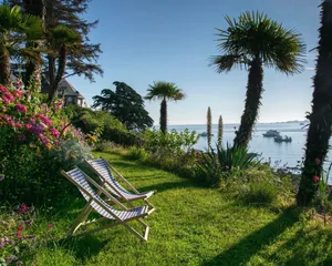 Image of Lancelot islet, sea view and feet in the water