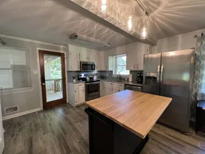 Image of Cheerful, relaxing ranch in quiet neighborhood with fire pit