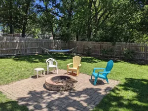 Image of Arnolds Park Cabin with kayaks, bikes, and golf cart