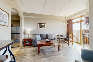 Image of Golf-front modern condo with fireplace, balcony, & golf course views