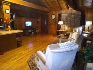 Image of Cedar Log Cabin home on wooded bluff nestled between Springfield and Branson