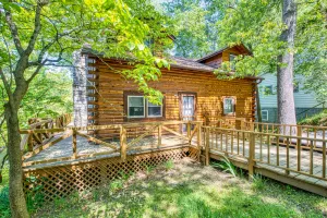 Image of Charming rustic cabin with spacious deck, pool access, and free WiFi