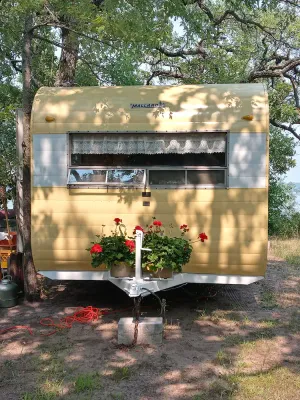Image of Vintage Camper Trailer - lakeside site 1 hour from Minneapolis St. Paul\nGlamping