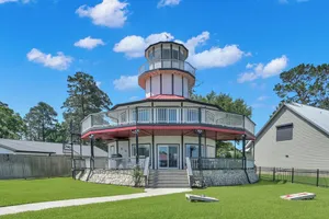 Image of Waterfront Lighthouse with Large Dock for a Great Family Getaway