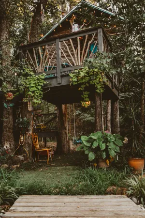 Image of The Treehouse, with a deck for grilling and relaxation.
