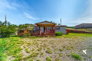 Image of Redman! A single level, cozy cabin on a hill with a direct view of the Ruidoso Downs Racetrack!