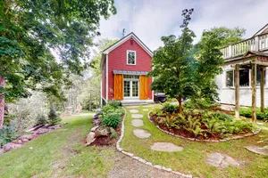 Image of Beautiful home right in town with private hot tub, firepit & lovely grounds
