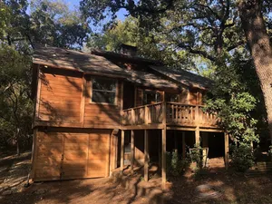 Image of Cedar Cabin on Stilts with 2 decks in the Trees by Lake Lewisville