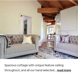 Image of Sandy's pottery cottage with lush green gardens