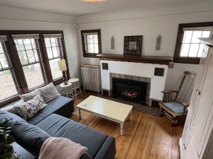 Image of Hygge House: fireplace and garage