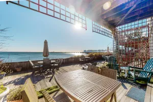 Image of Beachfront condo in the heart of town with water views, patio & grill
