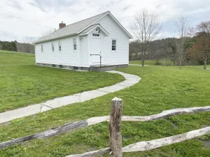 Image of 19th century school house converted into a charming two story dwelling
