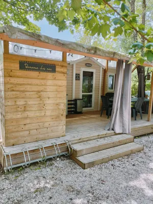 Image of Mobilhome 4-6 pers Drôme Vercors in campsite with swimming pool and river