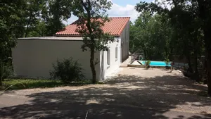 Image of Modern wooden house with tree terrace and private heated pool