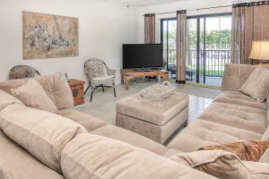 Image of Elegant 1st-floor condo w\/private patio, AC, on-site outdoor pool & gas grills