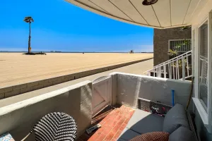 Image of Warming single-level beachfront condo home with full kitchen, patio, & fireplace