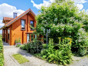 Image of Cozy log cabin by the forest with large garden