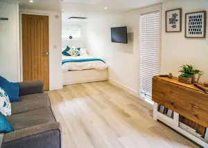 Image of Comfortable open-plan, studio-style accommodation with double bed, sofa bed and kitchenette.