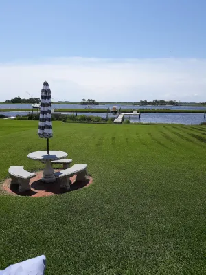 Image of View of intracoastal waterway with private dock and boat lift.