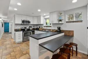 Image of Basement Retreat: Private Entry, Updated, Ski Passes, Sleeps 8, Near Trax Station, 3 TVs, Patio!