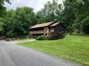 Image of Log cabin nestled beside Chiques Creek in historic Lancaster County