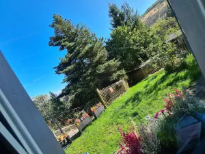 Image of Garden view holiday flat 50sqm with terrace, garden, fireplace and open kitchen with bar