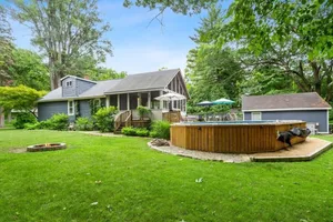 Image of Charming cottage with fast WiFi, fire pit, above-ground pool, & huge sunroom
