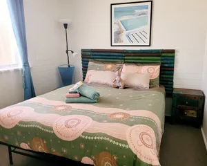 Image of Nestled behind the low hanging branches is this cute and cozy one bedroom unit