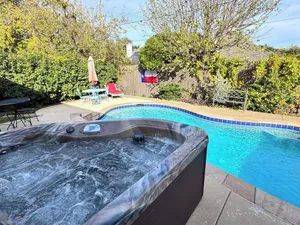 Image of Private Hot Tub & Pool, Fenced Yard, & Walking Distance To Shopping
