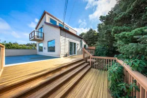 Image of Family-friendly house near the beach with gas fireplace and sprawling deck